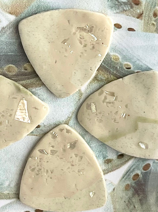guitar picks (4) made of pink abalone clay