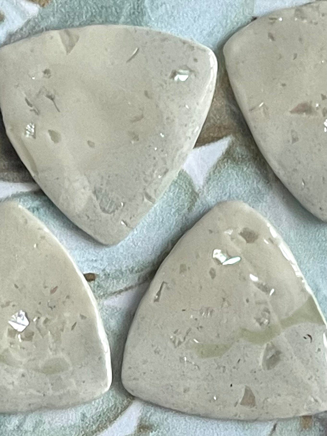 guitar picks (4) made of pink abalone clay