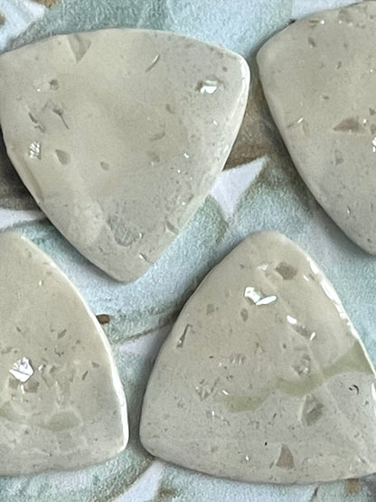 guitar picks (4) made of pink abalone clay