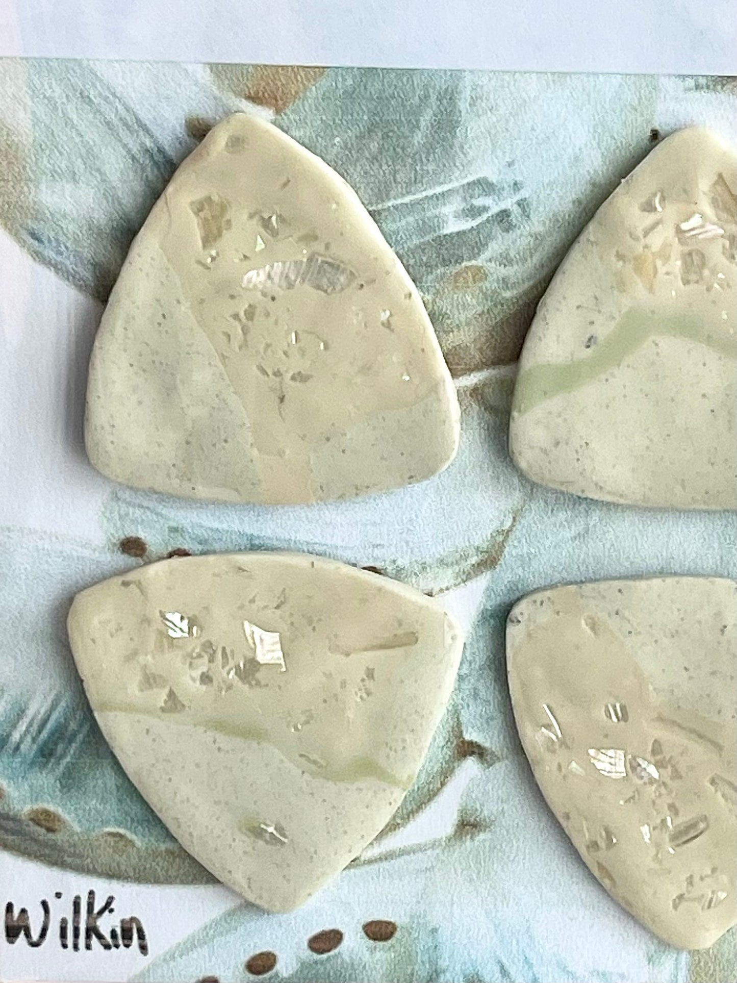guitar picks (4) made of pink abalone clay