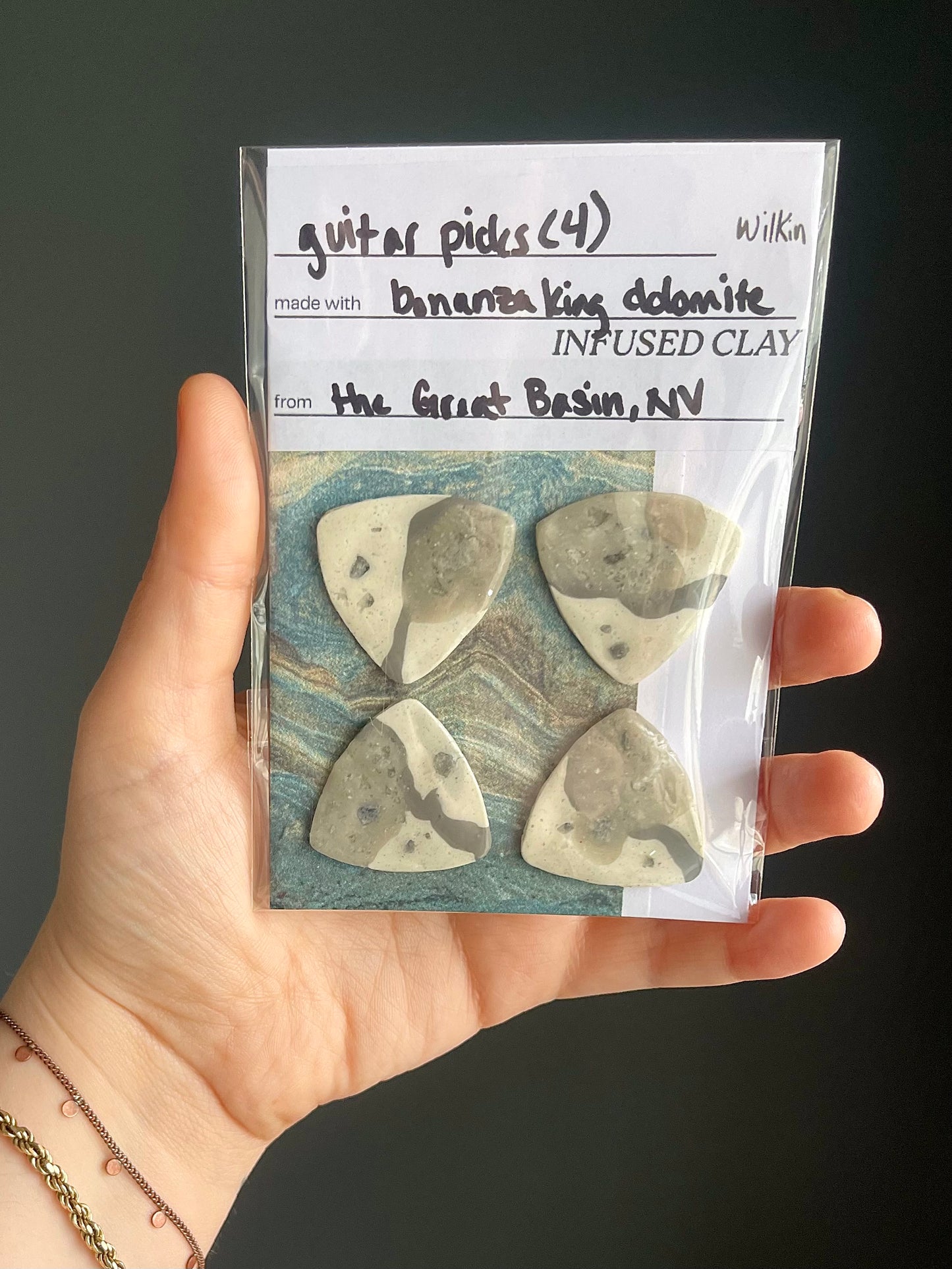 guitar picks (4) made of bonanza king dolomite clay