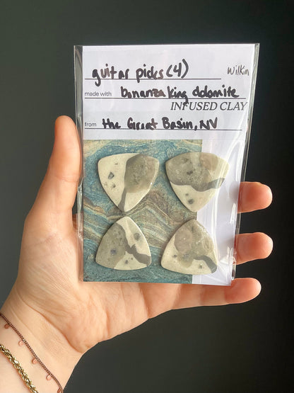 guitar picks (4) made of bonanza king dolomite clay