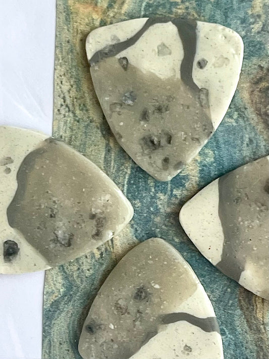 guitar picks (4) made of bonanza king dolomite clay