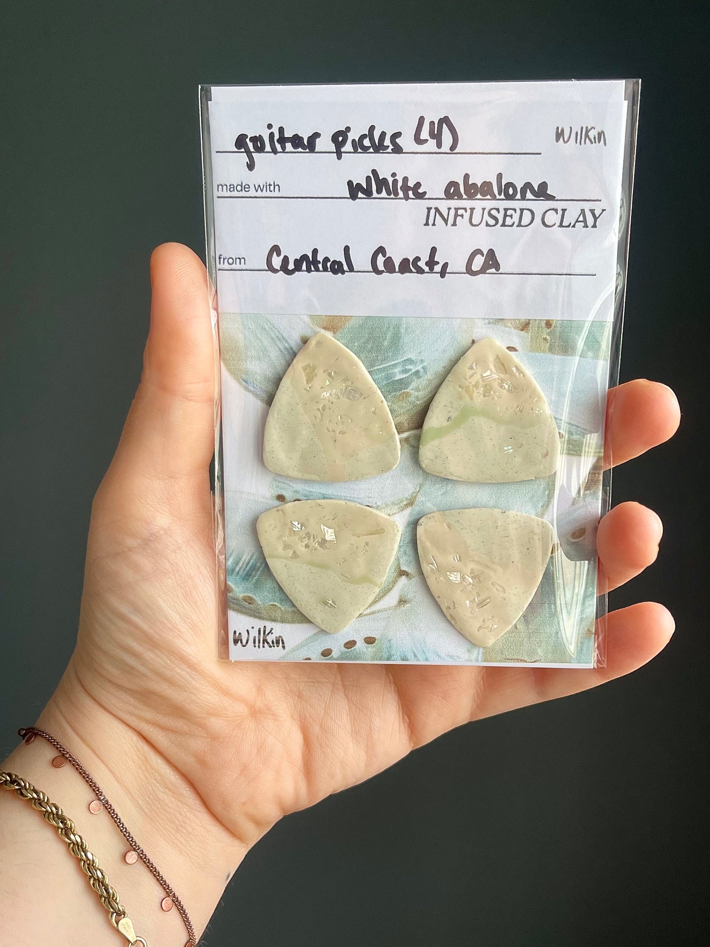 guitar picks (4) made of pink abalone clay