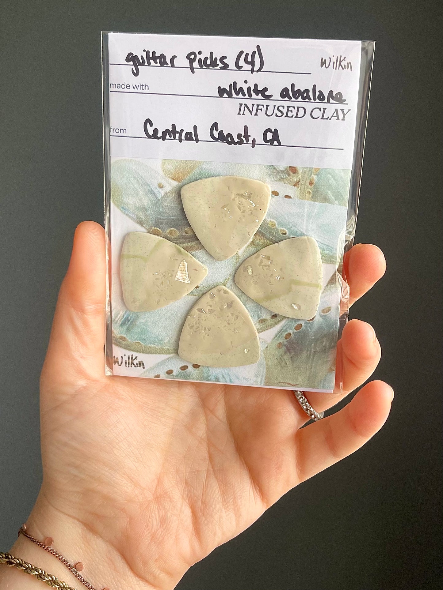 guitar picks (4) made of pink abalone clay