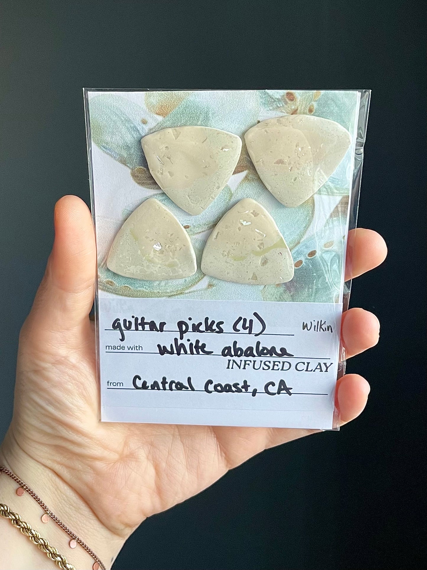 guitar picks (4) made of pink abalone clay