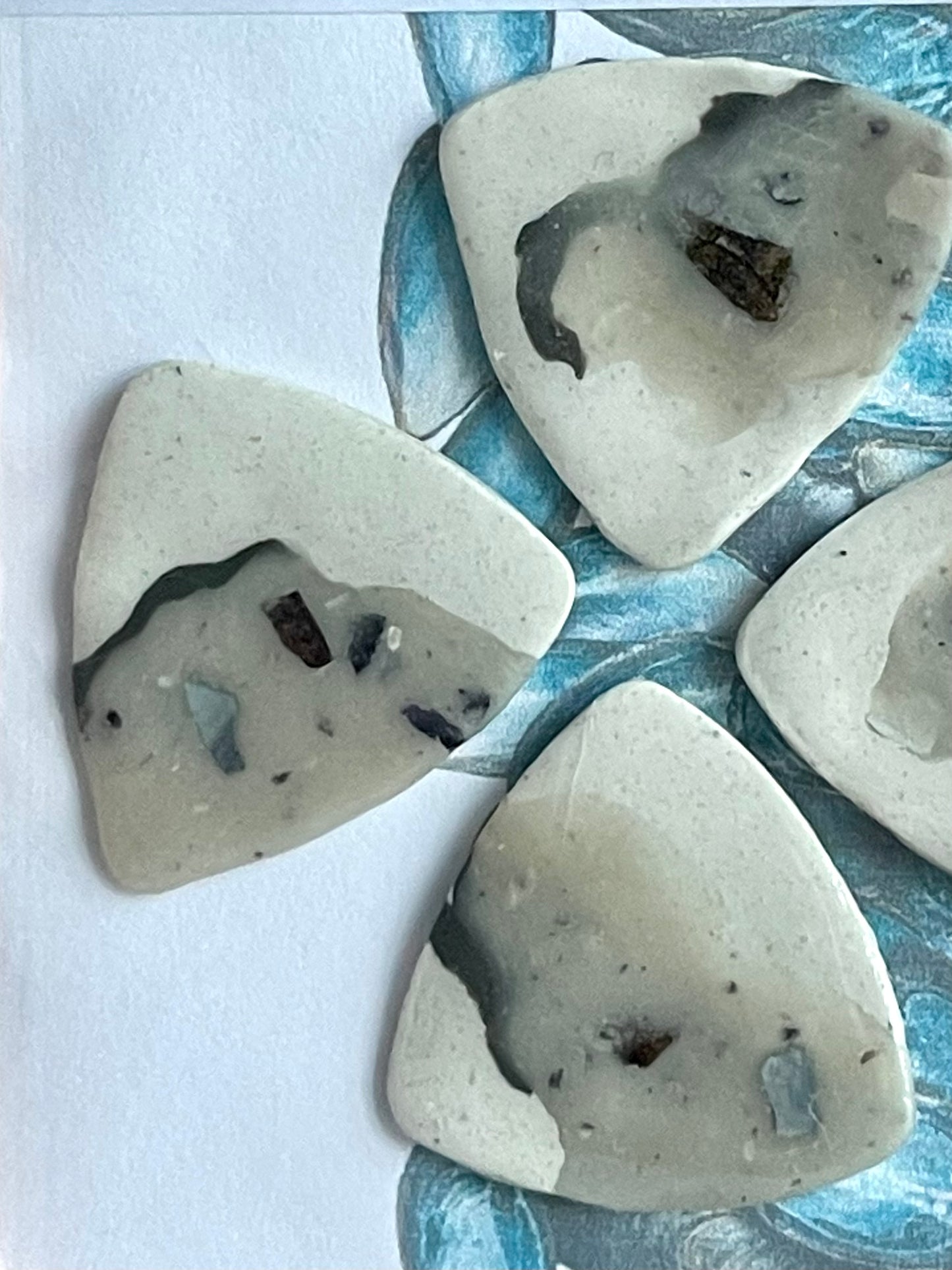 guitar picks (4) made of blue mussel clay